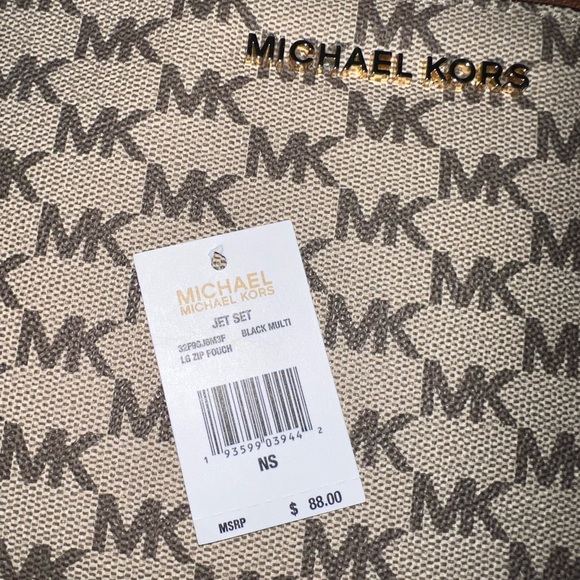 Michael Kors Wristlet Wallet. Review photos for wear. Make an offer. - Picture 4 of 5